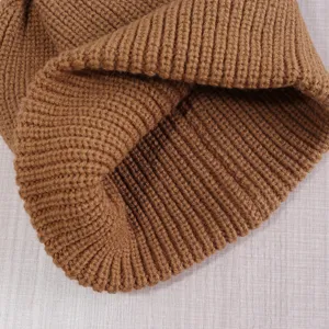 Close up view of cozy brown ribbed knit beanie hat, thick warm winter ski cap for men and women.