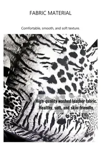 Detailed view of the black and white animal print leather fabric for stylish women's handbags.