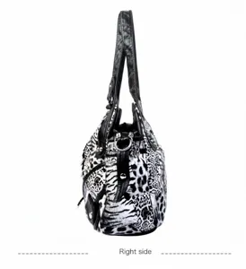 Fashionable black and white animal print women shoulder handbag, side view detail display.