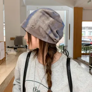 Vintage tie-dye slouchy beanie hat with metal star detail, casual winter warm headwear.