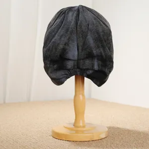 Detail view of retro tie-dye slouchy beanie hat, soft textured fabric for autumn and winter warmth.