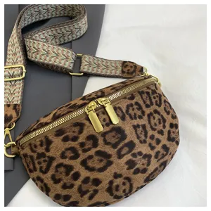 Leopard print crossbody chest bag detail showing gold zippers and patterned wide strap.