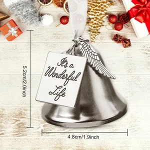 Christmas bell ornament with angel wing and plaque, detailed view of holiday hanging decor.