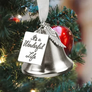 Christmas tree metal bell ornament with angel wing and engraved tag for holiday decor.