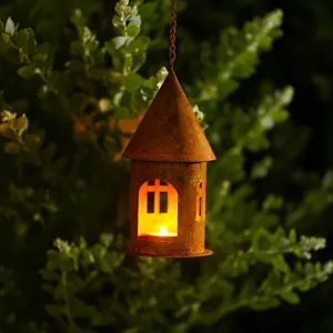 Rustic metal castle candle holder hanging house ornament with warm light for garden decor detail