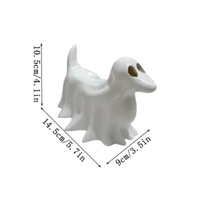 Close-up details of the white ghost puppy resin ornament showing hollow eyes and cute shape.