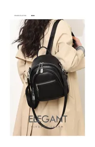 Detailansicht eines schwarzen Rucksacks aus weichem Leder mit mehreren Reißverschlüssen.
