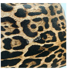 Leopard print detail shot of women fashion clutch bag, showing unique texture and stylish pattern.