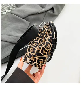 Chic leopard print crossbody bag for women, stylish clutch and shoulder bag with wide strap.