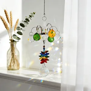 Crystal glass suncatcher pendant, hanging mini chandelier design with colorful light refractions.