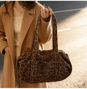 Leopard print canvas shoulder bag, stylish retro casual tote detail showing unique texture.
