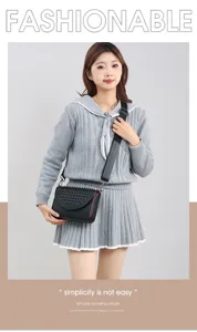 Stylish women crossbody bag with metal rivets and adjustable strap for daily commuting.