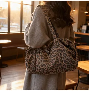 Detail view of vintage leopard print canvas shoulder bag, stylish casual daily accessory for women.