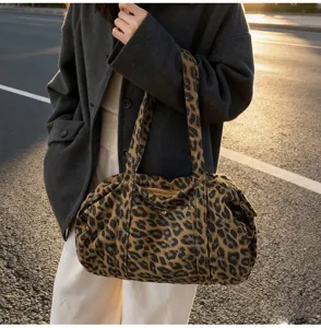 Leopard print canvas shoulder bag, casual retro tote bag with durable straps and zipper.