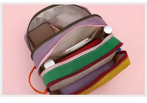 Detailed view of the multi-layer color block nylon cosmetic bag interior storage.