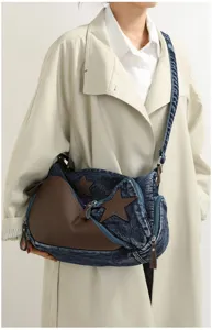 Fashion denim patchwork shoulder bag with brown leather and stars for women daily use.