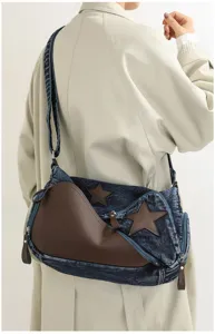 Denim shoulder bag detail showcasing star appliqué and contrast brown leather patchwork design.
