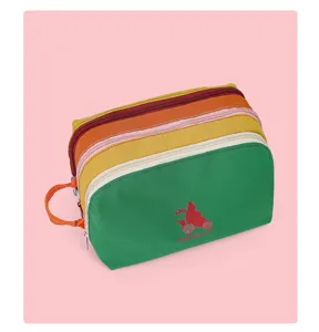 Multi-compartment colorful nylon cosmetic bag, large capacity travel toiletry pouch for women.