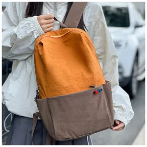 Casual two-tone backpack for travel and outdoor sports with large capacity and stylish look.