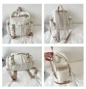 Vue détaillée du sac à dos en nylon avec poches zippées, cordon de serrage et boucles.