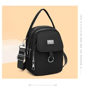 Stylish women's black nylon crossbody shoulder bag with multi zippers and top handle.