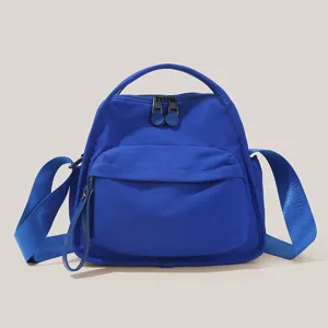 Blue versatile lightweight commuter crossbody bag, spacious daily handbag with durable straps.