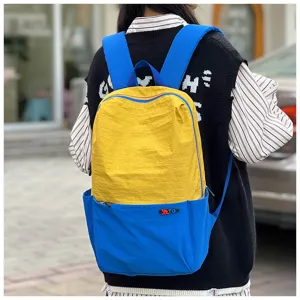 Outdoor travel casual dopamine color backpack showcasing dual-tone design and large capacity worn.