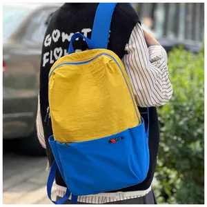 Vibrant colorblock travel backpack, yellow blue casual daypack, outdoor sports bag.