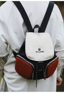 Casual colorblock mini backpack featuring multiple zipper pockets and comfortable shoulder straps.