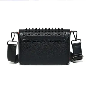 Black leather studded crossbody bag with chic spikes, stylish shoulder bag for women daily commute.