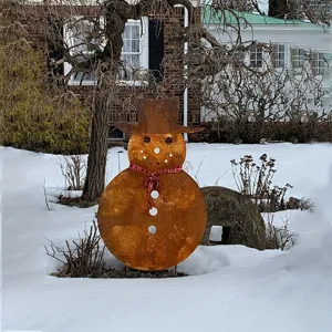 Rusted metal snowman garden stake with top hat and scarf, perfect Christmas outdoor decor.