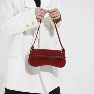 Retro rivet shoulder bag for women, stylish underarm purse with elegant daily design.