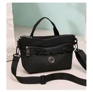 Black plaid crossbody bag for women, stylish casual shoulder bag with top handle and strap.