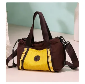 Borsa da viaggio marrone compatta con tasca gialla, comoda borsa a mano e tracolla casual.