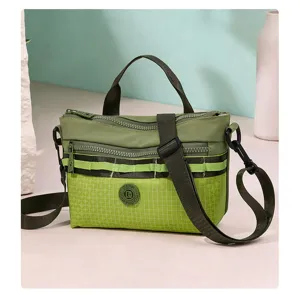 Casual green nylon grid crossbody bag with multiple zip compartments and stylish strap.