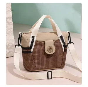 Detail view of stylish nylon plaid women shoulder crossbody bag with comfortable top handle.