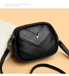 Classic black leather crossbody bag for women, stylish underarm shoulder bag with deer logo.