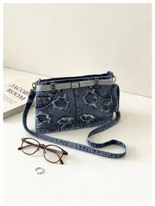 Borsa a tracolla alla moda in denim per donna con design tascabile e cinghia elegante.