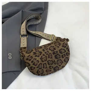 Leopard print crescent crossbody bag detail showcasing retro style wide strap and quality hardware.