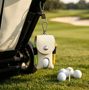 Detail view of a white leather golf ball pouch with metal clip, tee holders, and golf balls.
