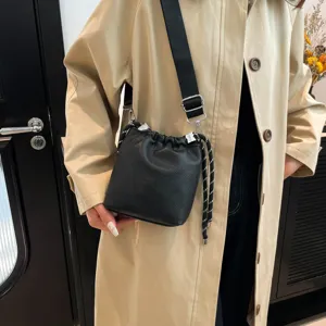 Black leather bucket bag women crossbody shoulder bag with drawstring and wide strap main view