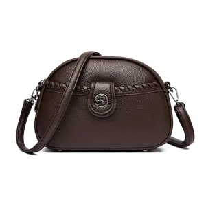 Classic brown leather crossbody bag for women, stylish dome shoulder bag with braided detail.