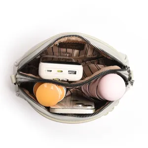 Stylish women's small round crossbody bag, grey leather shoulder bag with large daily capacity.