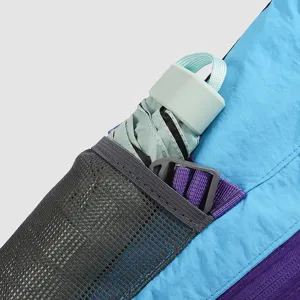 Multifunctional crossbody bag detail view with mesh pocket and compact folding umbrella.