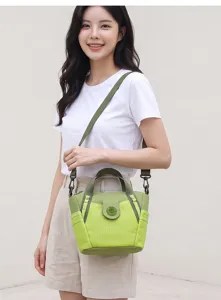 Stylish women's nylon shoulder bag with top handle and adjustable crossbody strap in green.