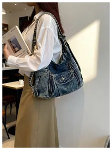 Denim hobo shoulder bag Y2K motorcycle style tote with star metal hardware for women.