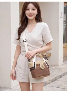 Detail view of stylish casual women shoulder bag with grid pattern, comfortable strap design.