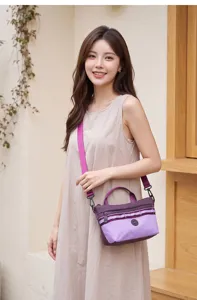 Stylish purple plaid crossbody shoulder bag for women, lightweight casual daily travel hand bag.
