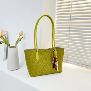Green woven leather tote bag for women, stylish large capacity shoulder bag with beaded charm.