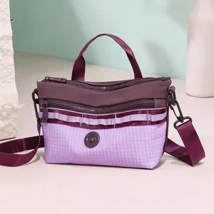 Purple grid crossbody shoulder bag with multi-zippers and casual stylish design main view.